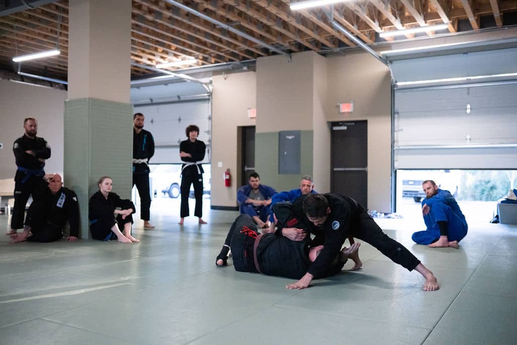 The Jiu Jitsu Institute instructor Gil showing students how to spar