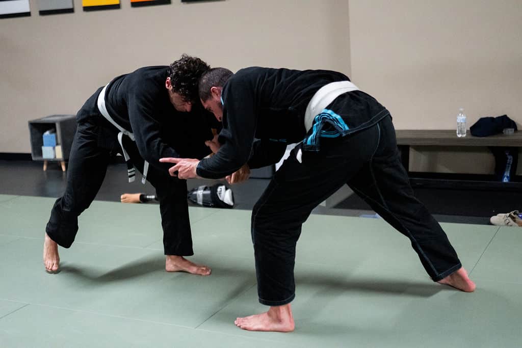 The Jiu Jitsu Institute two male students sparring