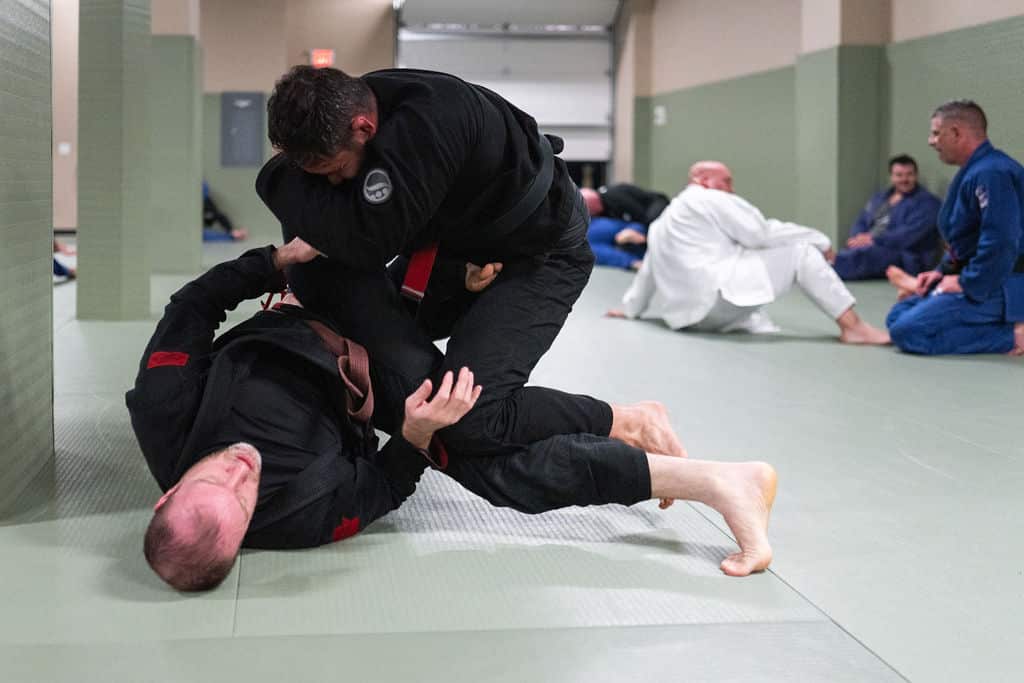 The Jiu Jitsu Institute students rolling in jiu jitsu class